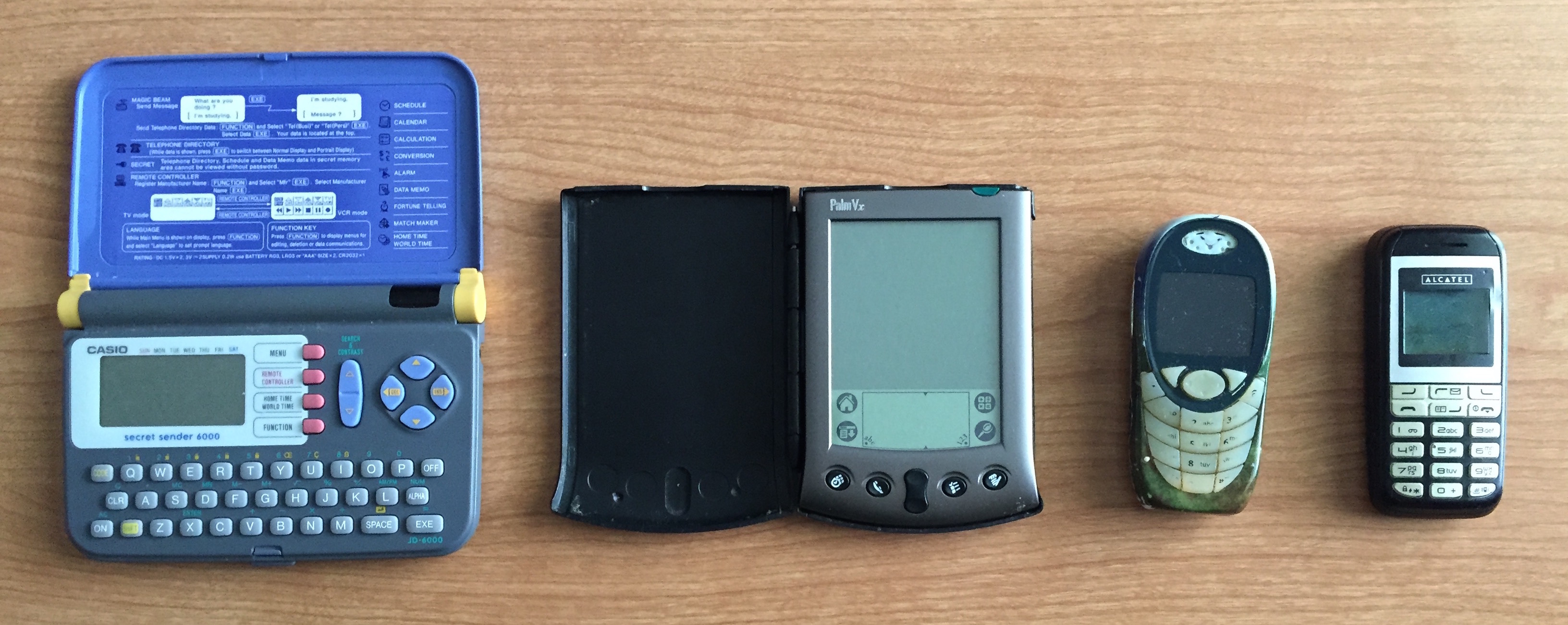 My first devices alternate view. From left to right -- Secret Sender, Palm Pilot, Siemens, Alcatel.