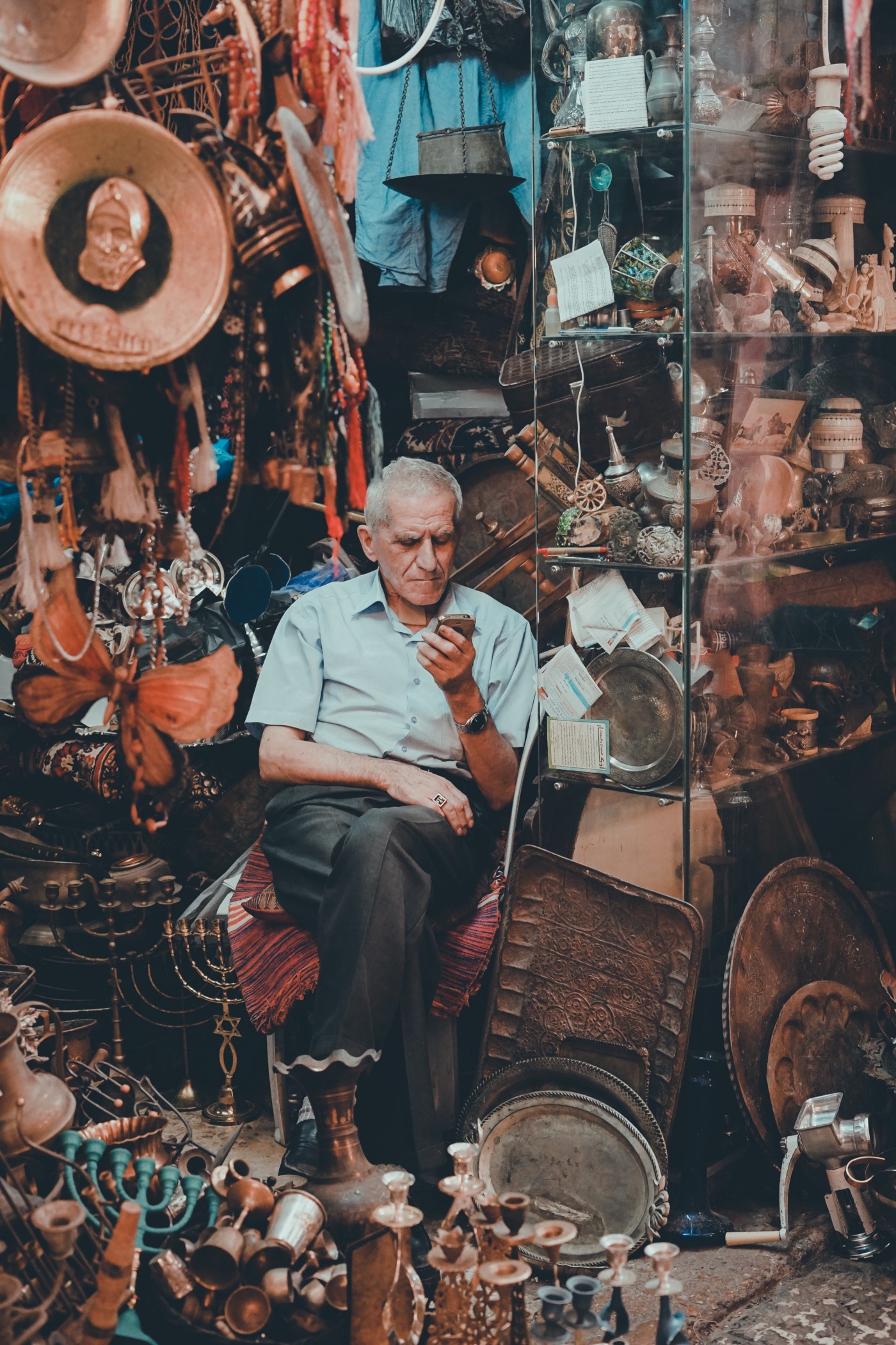 Man in Shop with Phone